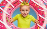 close-up-portrait-cheerful-adorable-ginger-girl-sticks-head-through-pink-rubber-ring-wears-goggles-bright-t-shirt-spends-summer-holiday-seaside-enjoys-swimming-happy-childhood-rest.jpg