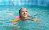 girl-happily-swim-pool-summer (1).jpg