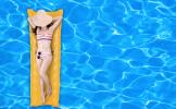 bigstock-Woman-Floating-On-A-Pool-Mattr-65882878.jpg